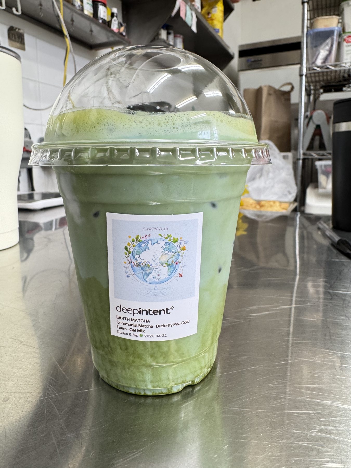 An iced ceremonial matcha with butterfly-pea cold foam, co-branded for a corporate Gleam & Sip activation in Toronto